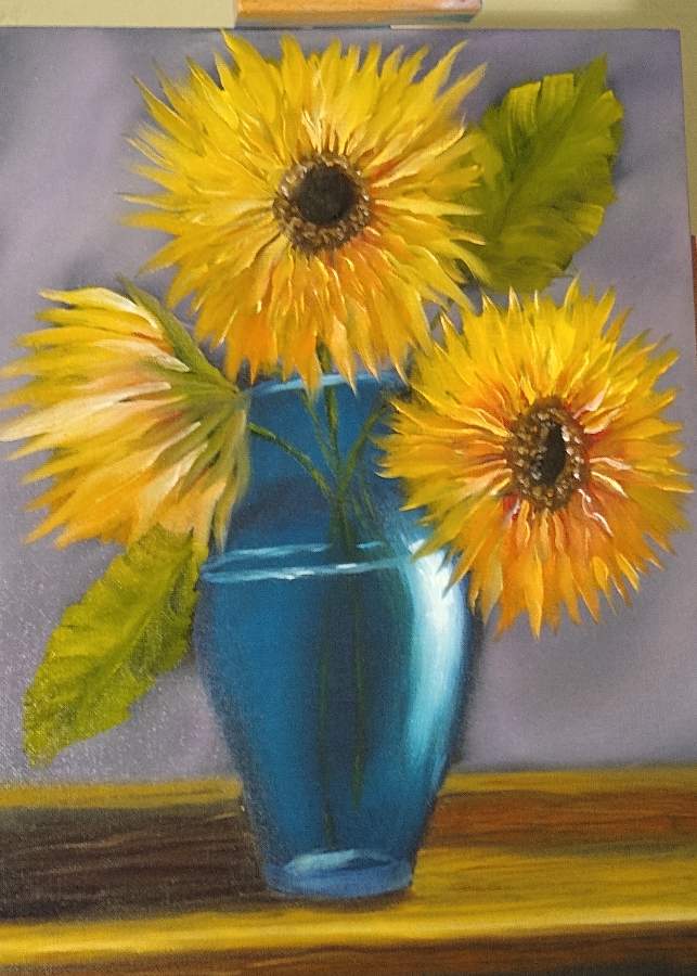 Sunflowers in a blue vase